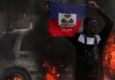 Overwhelmed Haitian police plead for help as gangs storm main prison to release convicts